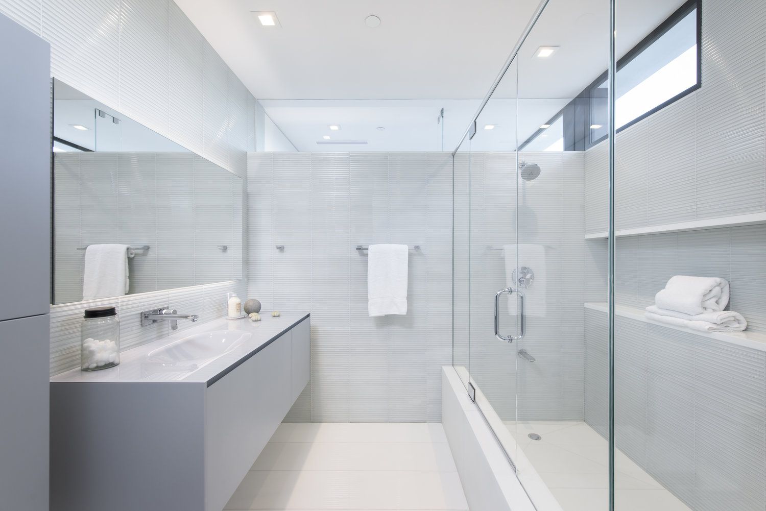If you're looking for ways to elevate the style of your gray bathroom, consider using glass accents. Glass accents can add a touch of elegance and sophistication to your bathroom while also creating a sense of spaciousness. You can use glass in a variety of ways, from shower doors and partitions to shelves and decorative accents. 