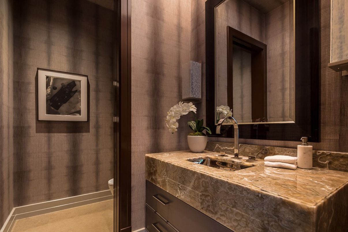 The key to small spaces is to give the impression of more space. And there isn't a better way to do so than by adding reflective surfaces that make the space appear larger. Imagine a large mirror covering the full wall behind the basin. Since glossy or metallic tiles also have reflected features, even the bathroom tile trends of 2023 may come in helpful.