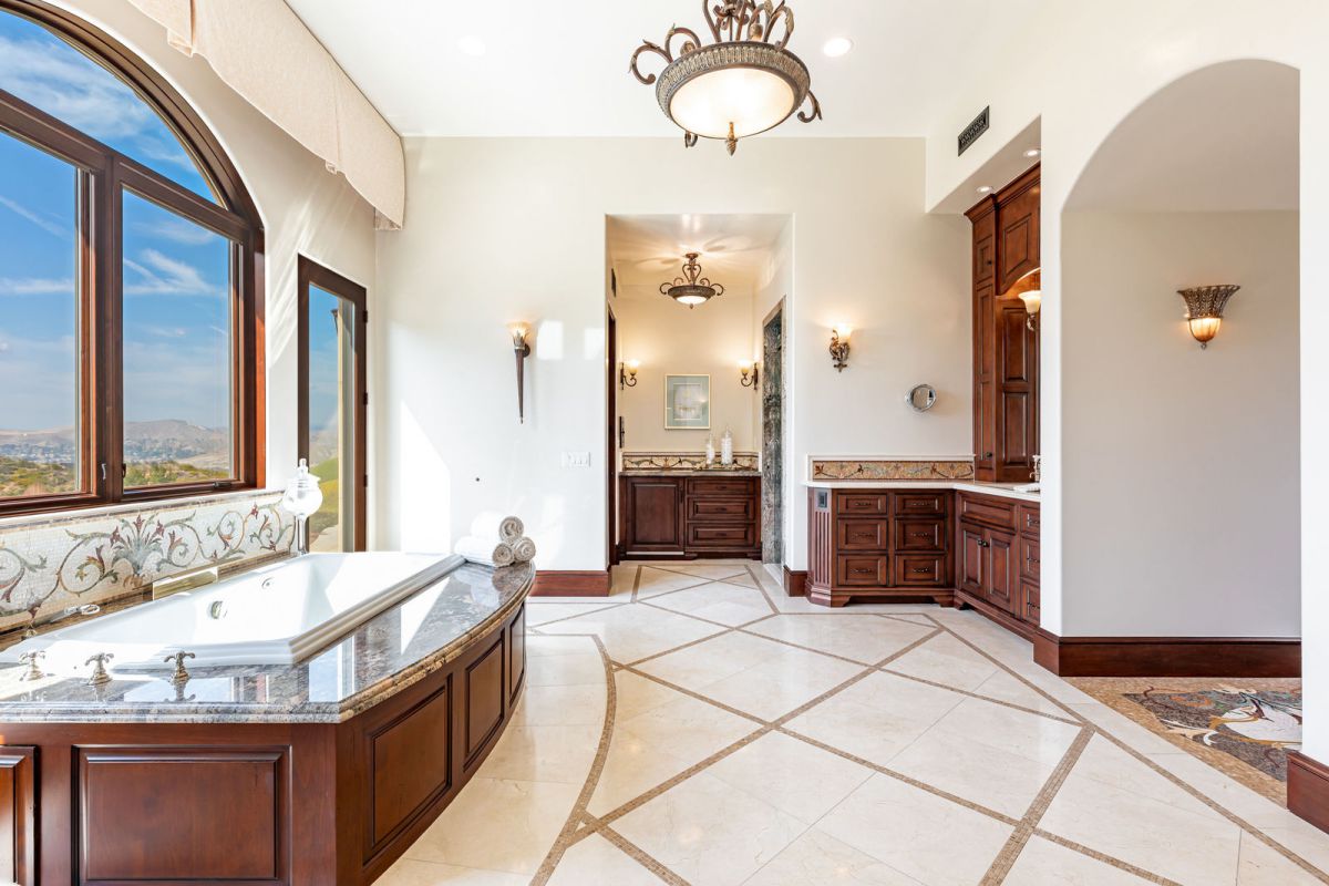 The bathroom has evolved into a great location for displaying ornamental lighting, from pendants to sconces and elaborate ceiling lights. Beautiful bathroom lighting may enhance the room's usefulness while also creating a calming ambience and adding a sculptural element.
