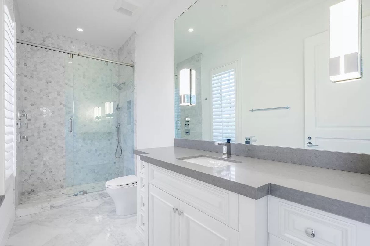 Not a fan of plain white walls? Instead, cover your walls with white tiles. Allow the tiles on your shower walls to fill the entire bathroom, or allow the backsplash on your bathtub to grow so tall that it hits the ceiling.
