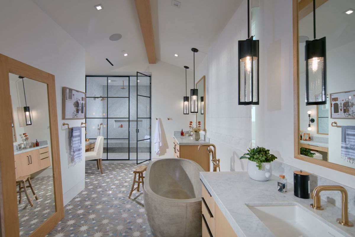 When you can't use color, texture becomes much more significant. Combine exposed wood beams with beadboard walls, a ceramic tub, and some gleaming tiles for good measure. A layered look offers the room language, depth, and personality.