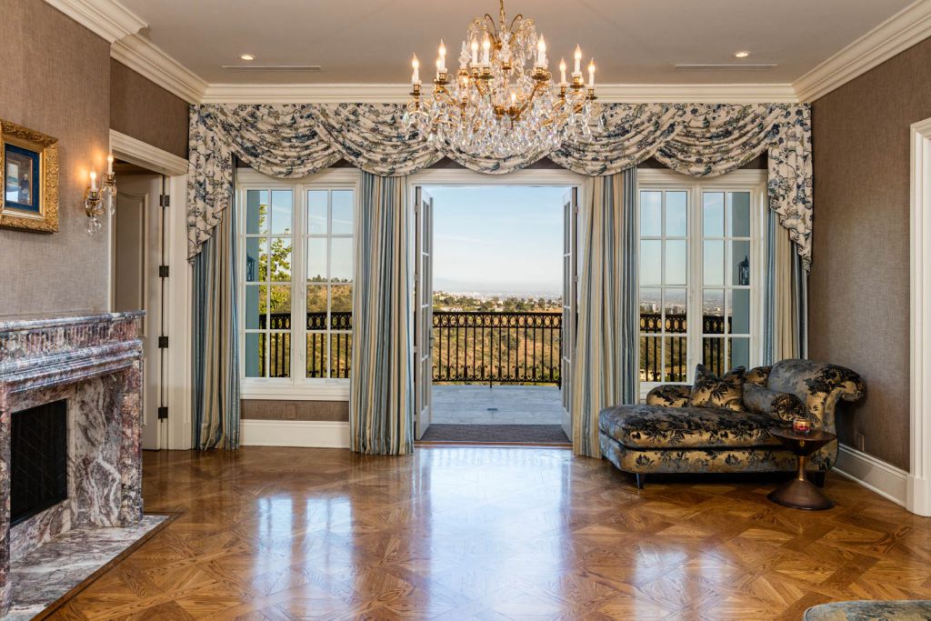 The Beverly Hills Mansion is an immaculate Colonial estate behind the guarded gates of Beverly Park now available for sale. This home located at 10 Beverly Park, Beverly Hills, California; offering 6 bedrooms and 11 bathrooms with over 13,000 square feet of living spaces.