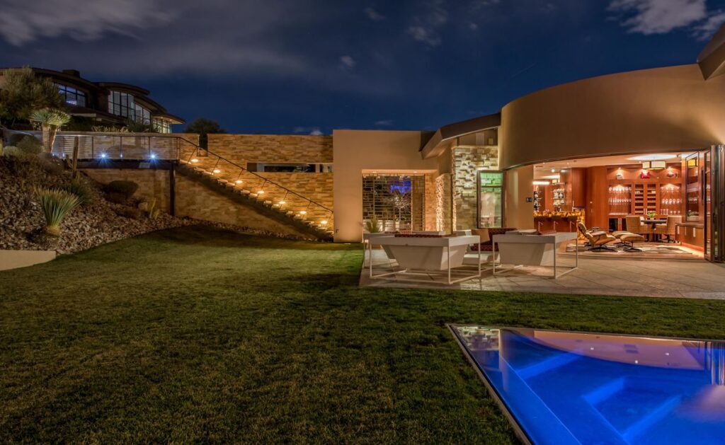 The Las Vegas Home for Sale is a luxuriously expansive and private estate in Summerlin now available for sale. This home located at 99 Hawk Ridge Dr, Las Vegas, Nevada; offering 8 bedrooms and 10 bathrooms with over 13,400 square feet of living spaces