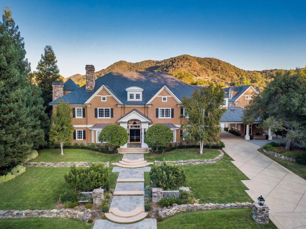 The Hamptons Style House is a Epic custom landmark estate with complete privacy and unobstructed fairway, lakes and mountain views now available for sale. This home located at 224 W Stafford Rd, Thousand Oaks, California; offering 5 bedrooms and 8 bathrooms with over 10,700 square feet of living spaces.