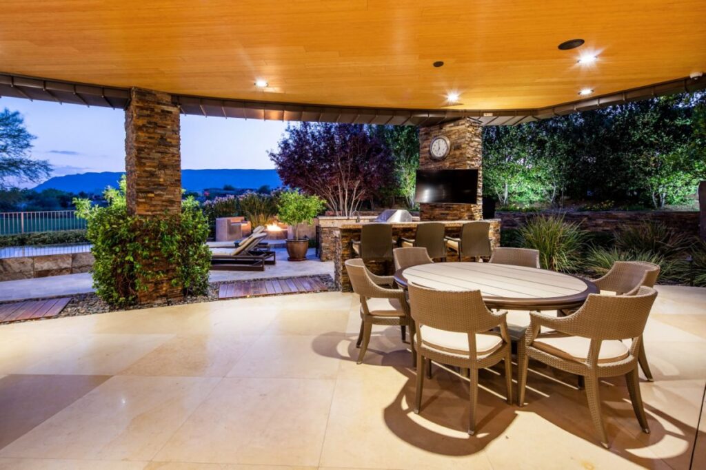 The Home in Las Vegas is a luxurious residence with a mix of natural, rustic materials and sleek contemporary design now available for sale. This home located at 11 Golden Sunray Ln, Las Vegas, Nevada; offering 5 bedrooms and 7 bathrooms with over 9,700 square feet of living spaces.