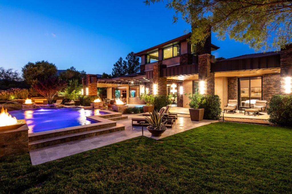 The Home in Las Vegas is a luxurious residence with a mix of natural, rustic materials and sleek contemporary design now available for sale. This home located at 11 Golden Sunray Ln, Las Vegas, Nevada; offering 5 bedrooms and 7 bathrooms with over 9,700 square feet of living spaces.