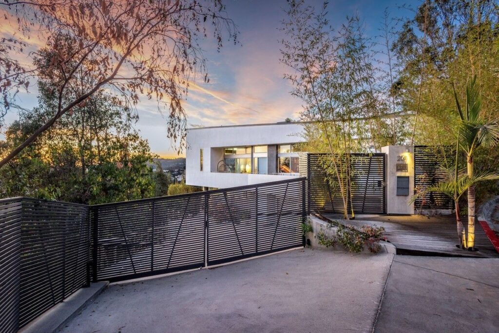 The Los Angeles Home is a gated modern classic estate perched atop the prestigious Oaks enclave of Los Feliz now available for rent. This home located at 2511 Wild Oak Dr, Los Angeles, California; offering 5 bedrooms and 6 bathrooms with over 4,100 square feet of living spaces.