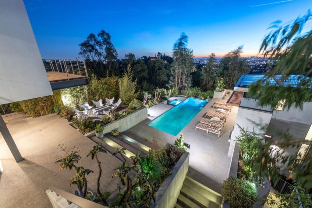 The Los Angeles Home is a gated modern classic estate perched atop the prestigious Oaks enclave of Los Feliz now available for rent. This home located at 2511 Wild Oak Dr, Los Angeles, California; offering 5 bedrooms and 6 bathrooms with over 4,100 square feet of living spaces.