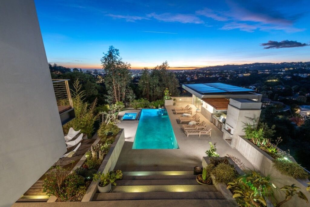 The Los Angeles Home is a gated modern classic estate perched atop the prestigious Oaks enclave of Los Feliz now available for rent. This home located at 2511 Wild Oak Dr, Los Angeles, California; offering 5 bedrooms and 6 bathrooms with over 4,100 square feet of living spaces.