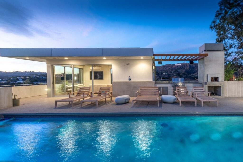 The Los Angeles Home is a gated modern classic estate perched atop the prestigious Oaks enclave of Los Feliz now available for rent. This home located at 2511 Wild Oak Dr, Los Angeles, California; offering 5 bedrooms and 6 bathrooms with over 4,100 square feet of living spaces.