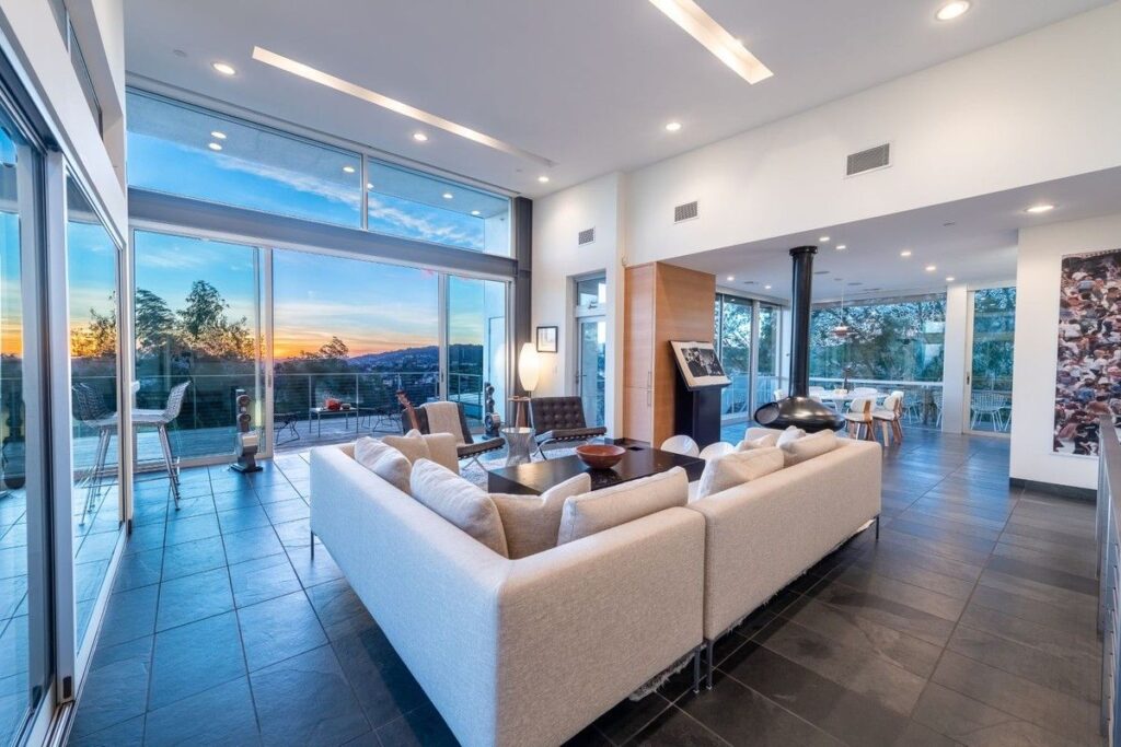 The Los Angeles Home is a gated modern classic estate perched atop the prestigious Oaks enclave of Los Feliz now available for rent. This home located at 2511 Wild Oak Dr, Los Angeles, California; offering 5 bedrooms and 6 bathrooms with over 4,100 square feet of living spaces.