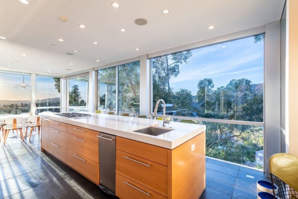 The Los Angeles Home is a gated modern classic estate perched atop the prestigious Oaks enclave of Los Feliz now available for rent. This home located at 2511 Wild Oak Dr, Los Angeles, California; offering 5 bedrooms and 6 bathrooms with over 4,100 square feet of living spaces.