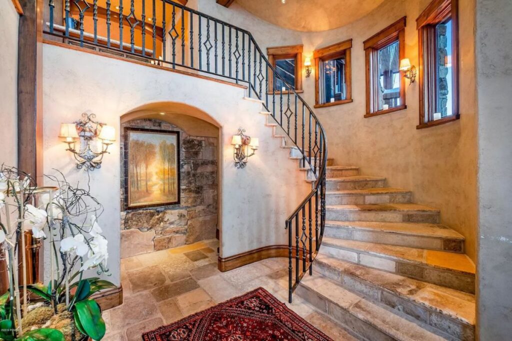 The Utah Property is a luxurious home with old-world craftsmanship and ski lodge comfort now available for sale. This home located at 10663 N Summit View Dr, Heber City, Utah; offering 9 bedrooms and 12 bathrooms with over 12,000 square feet of living spaces.