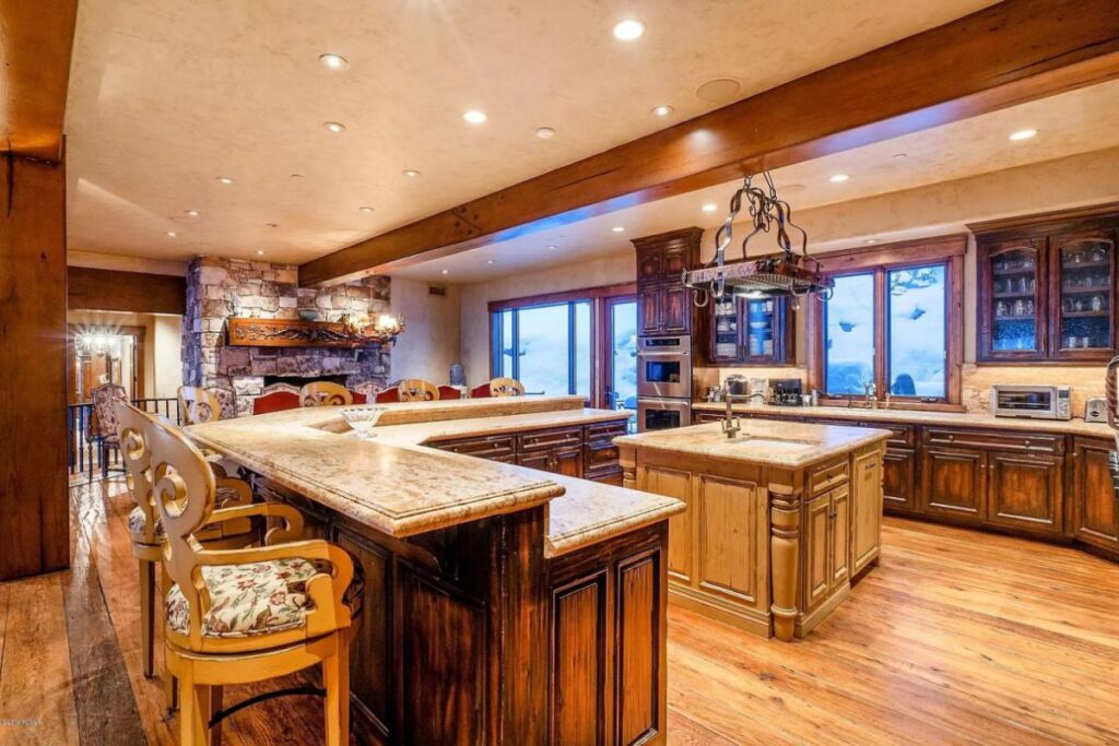 The Utah Property is a luxurious home with old-world craftsmanship and ski lodge comfort now available for sale. This home located at 10663 N Summit View Dr, Heber City, Utah; offering 9 bedrooms and 12 bathrooms with over 12,000 square feet of living spaces.