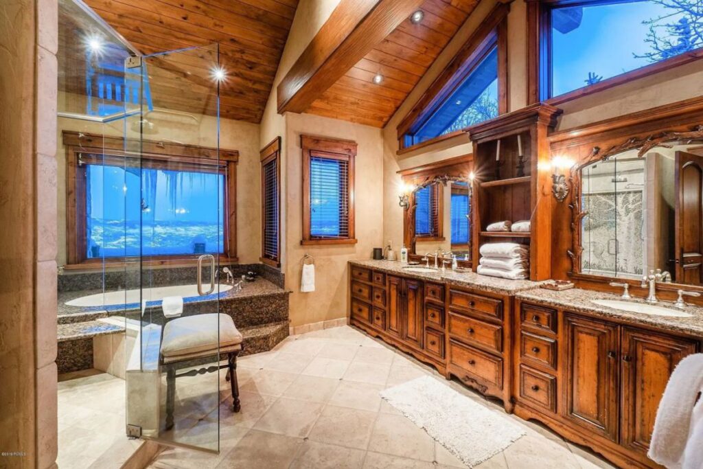 The Utah Property is a luxurious home with old-world craftsmanship and ski lodge comfort now available for sale. This home located at 10663 N Summit View Dr, Heber City, Utah; offering 9 bedrooms and 12 bathrooms with over 12,000 square feet of living spaces.