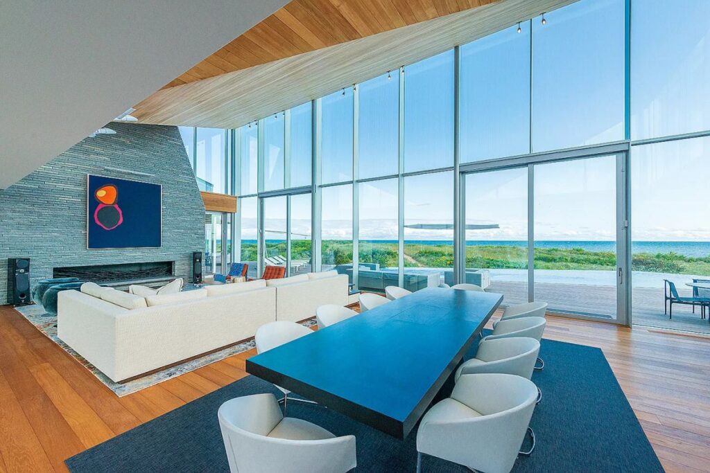 The New York Home is a luxurious sweeping residence is one of only seven oceanfront homes in the desirable hamlet of Wainscott now available for sale. This home located at 115 Beach Lane, Wainscott, New York; offering 6 bedrooms and 11 bathrooms with over 11,000 square feet of living spaces.