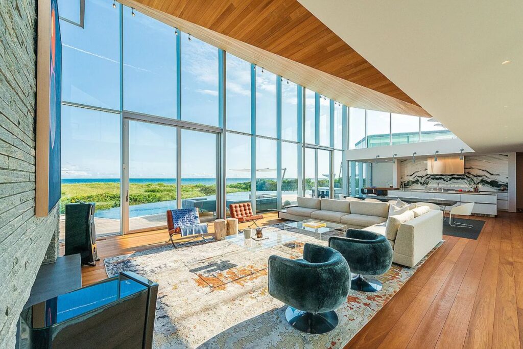 The New York Home is a luxurious sweeping residence is one of only seven oceanfront homes in the desirable hamlet of Wainscott now available for sale. This home located at 115 Beach Lane, Wainscott, New York; offering 6 bedrooms and 11 bathrooms with over 11,000 square feet of living spaces.