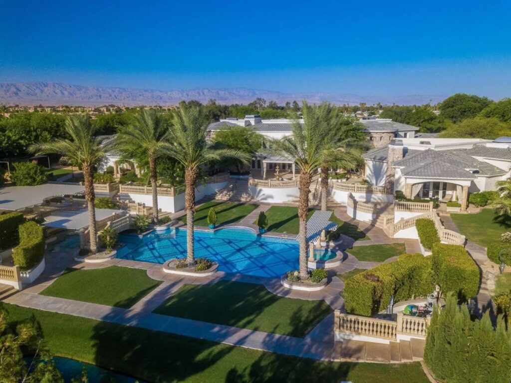 The Rancho Mirage Home is a true family sanctuary with spectacular views of mountains, lake, gardens now available for sale. This home located at 1 St Petersburg Ct, Rancho Mirage, California; offering 7 bedrooms and 9 bathrooms with over 17,800 square feet of living spaces.