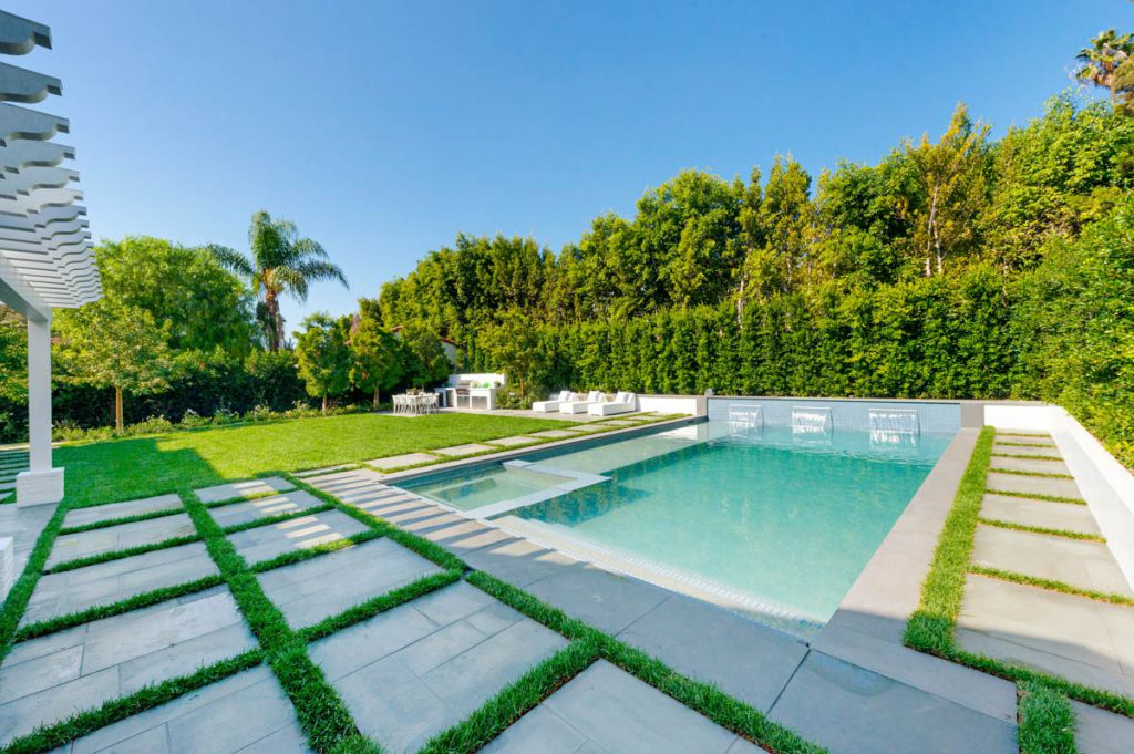 The Home in Pacific Palisades is a spectacular Traditional Estate nestled on one of the most coveted tree-lined streets in the Riviera section now available for sale. This home located at 957 Corsica Dr, Pacific Palisades, California; offering 7 bedrooms and 9 bathrooms with over 9,000 square feet of living spaces.