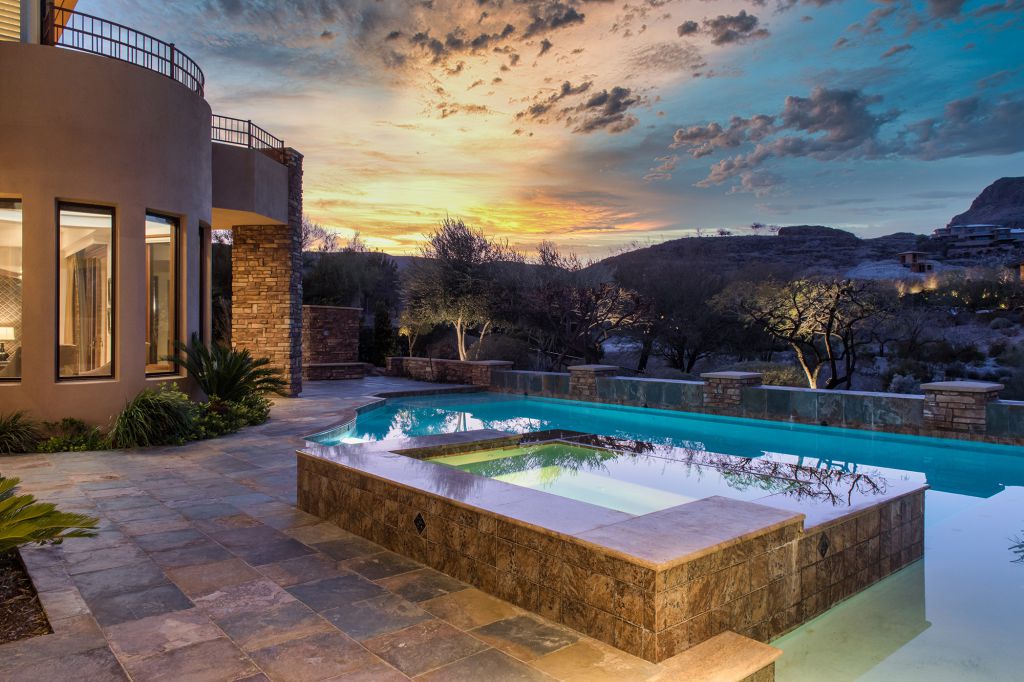 The Las Vegas Home is a luxurious residence with exceptional views of the mountains now available for sale. This home located at 15 Wild Ridge Ct, Las Vegas, Nevada; offering 5 bedrooms and 6 bathrooms with over 9,900 square feet of living spaces.