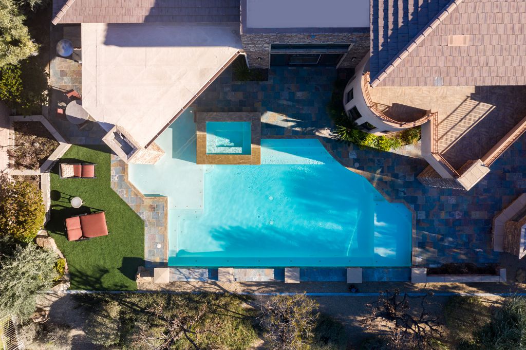 The Las Vegas Home is a luxurious residence with exceptional views of the mountains now available for sale. This home located at 15 Wild Ridge Ct, Las Vegas, Nevada; offering 5 bedrooms and 6 bathrooms with over 9,900 square feet of living spaces.