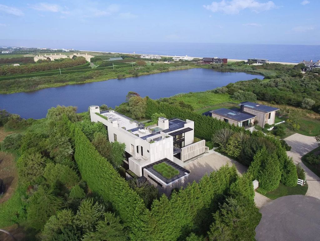 The Estate in New York is a luxurious modern estate recently completed near the ocean in Sagaponack now available for sale. This home located at 142 Crestview Ln, Sagaponack, New York; offering 8 bedrooms and 14 bathrooms with over 14,000 square feet of living spaces. 