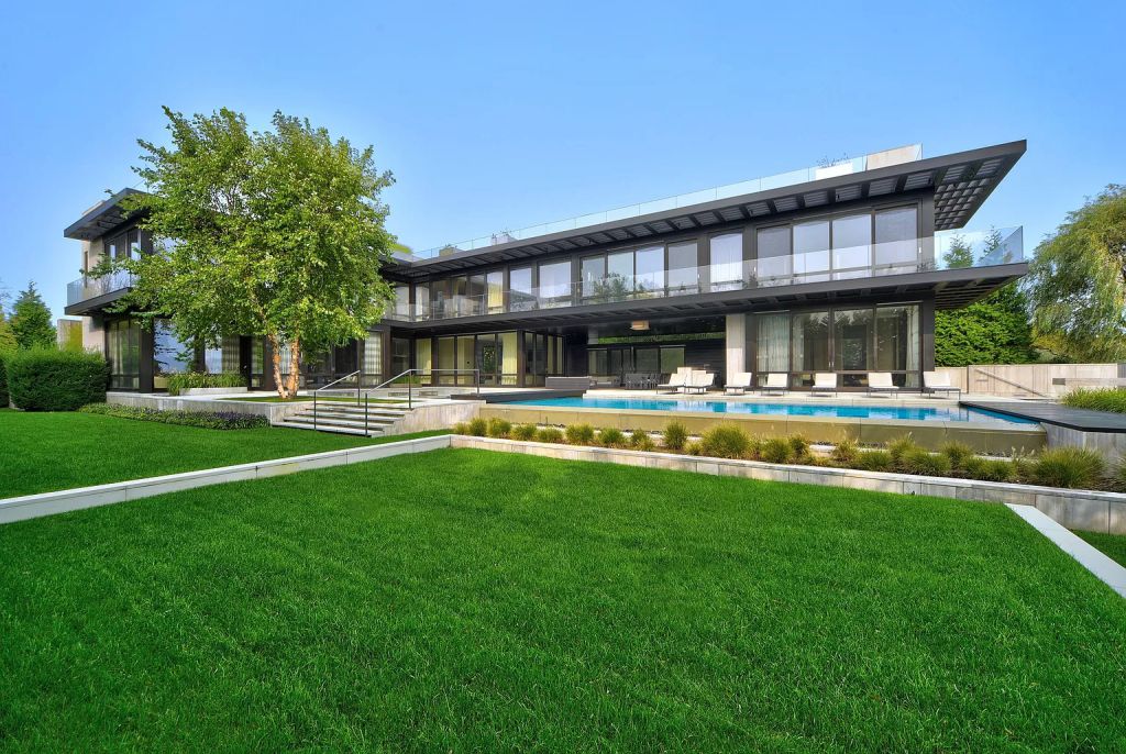 The Estate in New York is a luxurious modern estate recently completed near the ocean in Sagaponack now available for sale. This home located at 142 Crestview Ln, Sagaponack, New York; offering 8 bedrooms and 14 bathrooms with over 14,000 square feet of living spaces. 