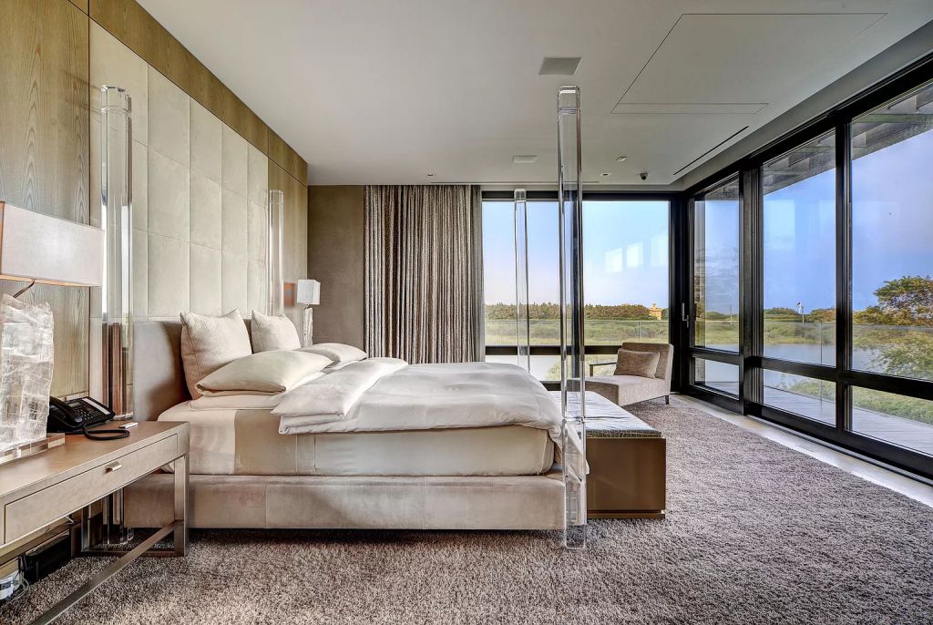 The Estate in New York is a luxurious modern estate recently completed near the ocean in Sagaponack now available for sale. This home located at 142 Crestview Ln, Sagaponack, New York; offering 8 bedrooms and 14 bathrooms with over 14,000 square feet of living spaces. 