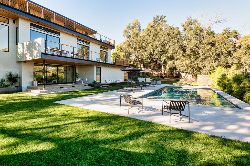 The Home for Sale in Encino is a architectural masterpiece with Exemplary exterior finishes include natural stone, cedar cladding. This home located at 16836 Marmaduke Pl, Encino, California; offering 7 bedrooms and 8 bathrooms with over 9,000 square feet of living spaces