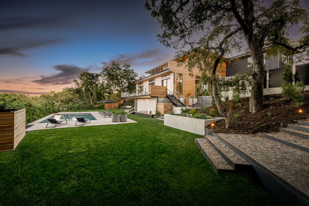 The Home for Sale in Encino is a architectural masterpiece with Exemplary exterior finishes include natural stone, cedar cladding. This home located at 16836 Marmaduke Pl, Encino, California; offering 7 bedrooms and 8 bathrooms with over 9,000 square feet of living spaces