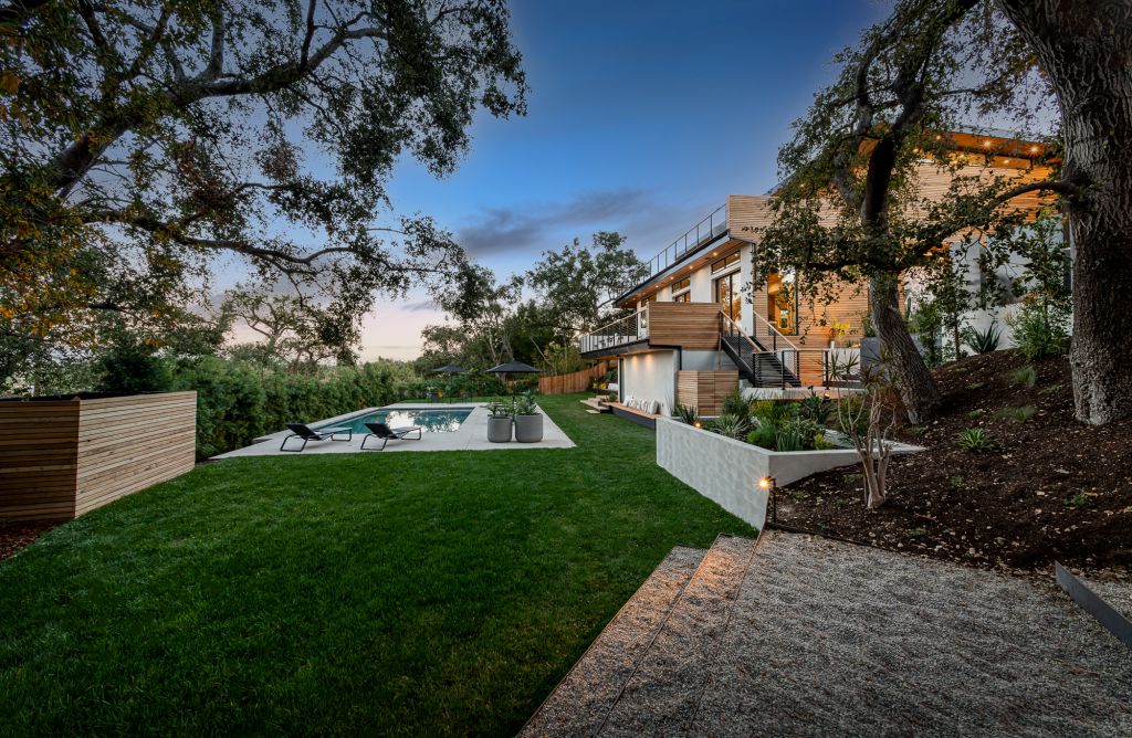 The Home for Sale in Encino is a architectural masterpiece with Exemplary exterior finishes include natural stone, cedar cladding. This home located at 16836 Marmaduke Pl, Encino, California; offering 7 bedrooms and 8 bathrooms with over 9,000 square feet of living spaces