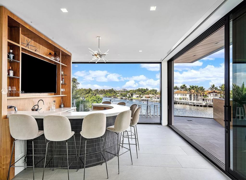 The Boca Raton Mansion is a spectacular contemporary residence on an oversized Intracoastal Waterway lot now available for sale. This home located at 819 Orchid Dr, Boca Raton, Florida; offering 9 bedrooms and 14 bathrooms with over 12,600 square feet of living spaces.
