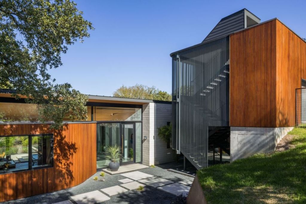 This Contemporary House in Austin, Texas, was designed by Ravel Architecture for clients in search of a quiet and private sanctuary; this house offers elegant living with fine finishes and smart amenities.