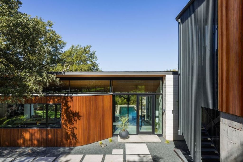This Contemporary House in Austin, Texas, was designed by Ravel Architecture for clients in search of a quiet and private sanctuary; this house offers elegant living with fine finishes and smart amenities.