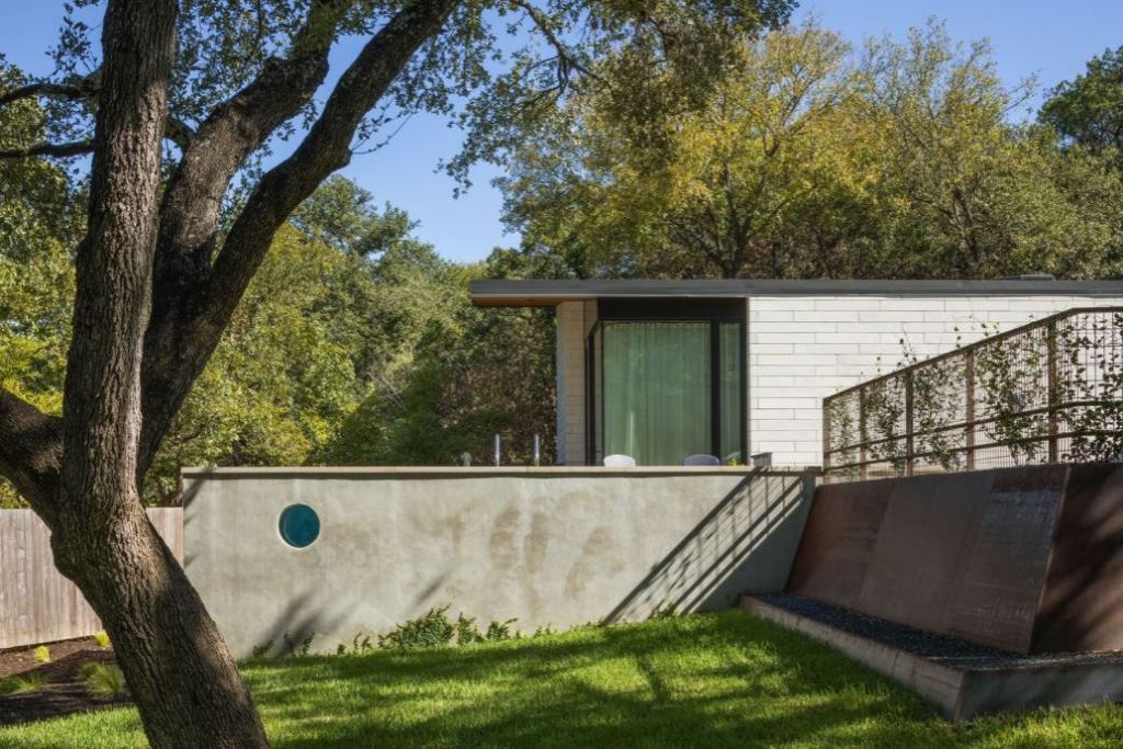 This Contemporary House in Austin, Texas, was designed by Ravel Architecture for clients in search of a quiet and private sanctuary; this house offers elegant living with fine finishes and smart amenities.