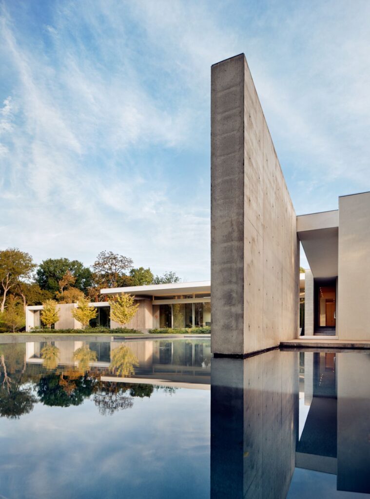 Preston Hollow Home in Dallas was designed by Specht Architects in Modern style from steel columns, frameless windows, and flowing water; this house providing a sense of privacy and seclusion from the street and surrounding neighborhood.