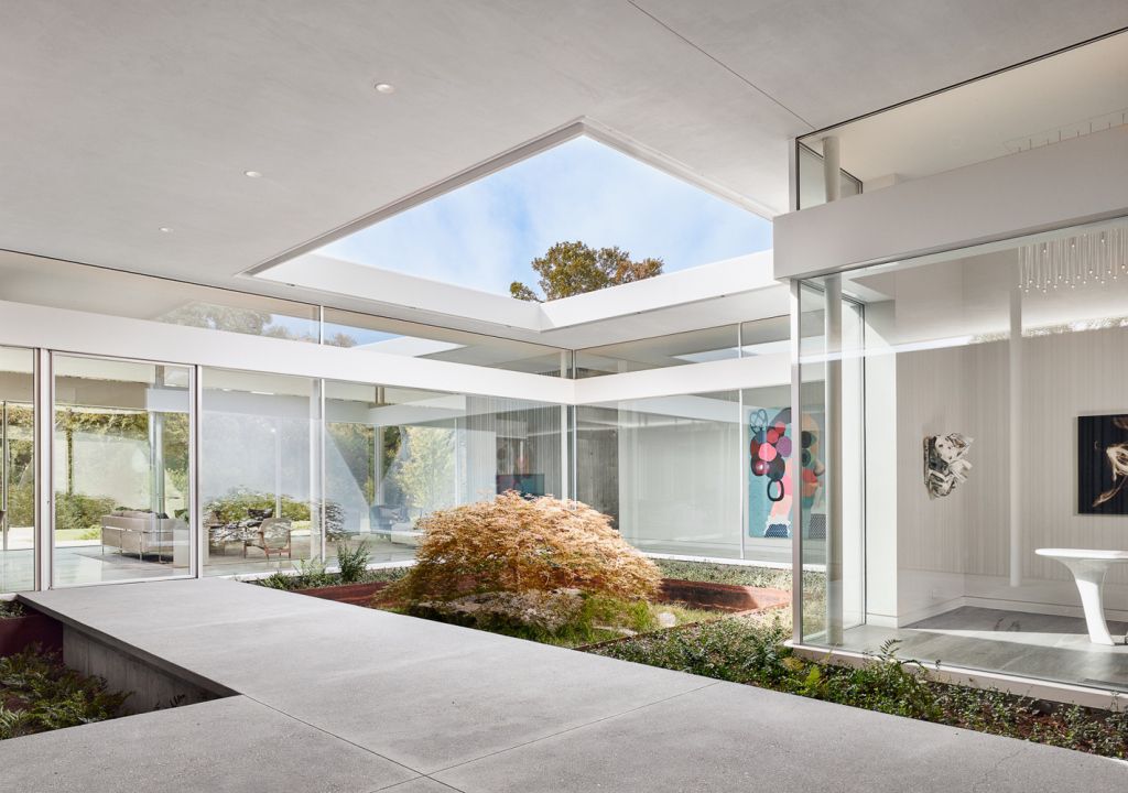 Preston Hollow Home in Dallas was designed by Specht Architects in Modern style from steel columns, frameless windows, and flowing water; this house providing a sense of privacy and seclusion from the street and surrounding neighborhood.