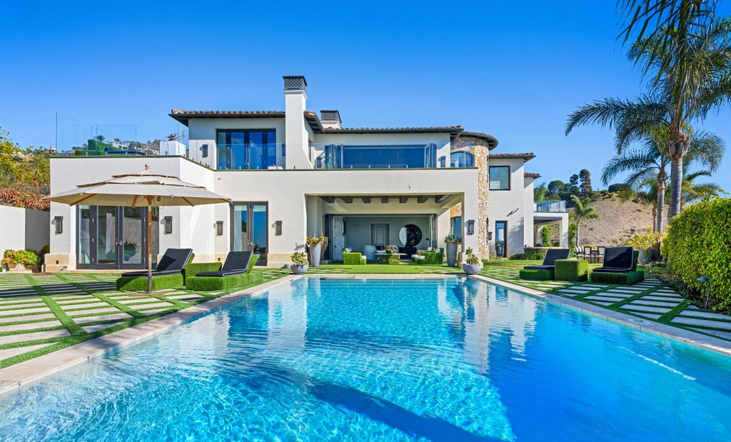 The Malibu Mansion is a private knoll top estate with exquisite finishes, superb quality, expansive views and lavish amenities now available for sale. This home located at 3905 Carbon Canyon Rd, Malibu, California; offering 6 bedrooms and 9 bathrooms with over 11,600 square feet of living spaces.