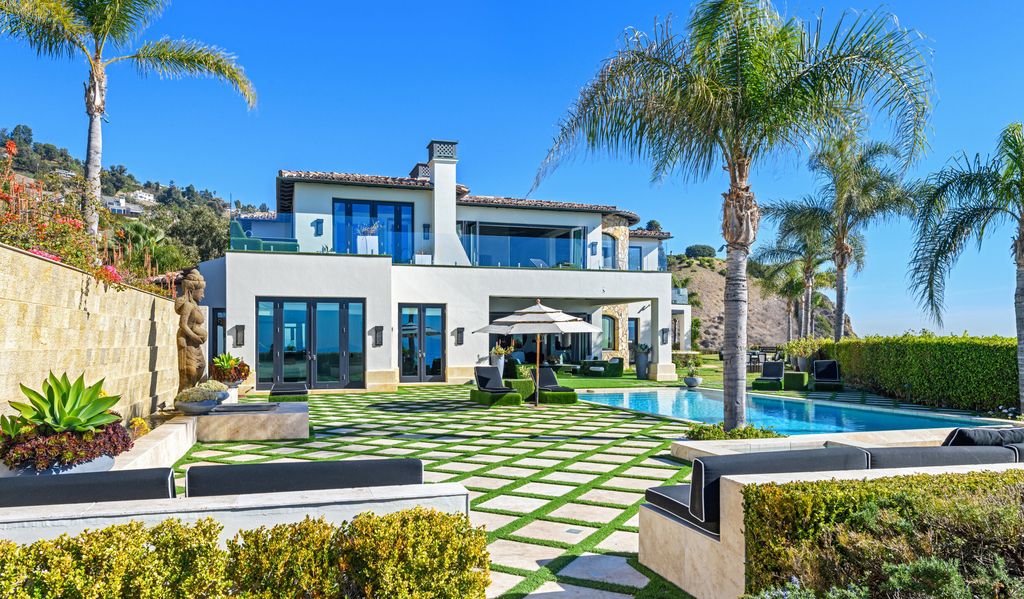 The Malibu Mansion is a private knoll top estate with exquisite finishes, superb quality, expansive views and lavish amenities now available for sale. This home located at 3905 Carbon Canyon Rd, Malibu, California; offering 6 bedrooms and 9 bathrooms with over 11,600 square feet of living spaces.