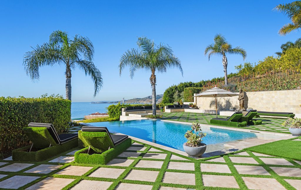 The Malibu Mansion is a private knoll top estate with exquisite finishes, superb quality, expansive views and lavish amenities now available for sale. This home located at 3905 Carbon Canyon Rd, Malibu, California; offering 6 bedrooms and 9 bathrooms with over 11,600 square feet of living spaces.