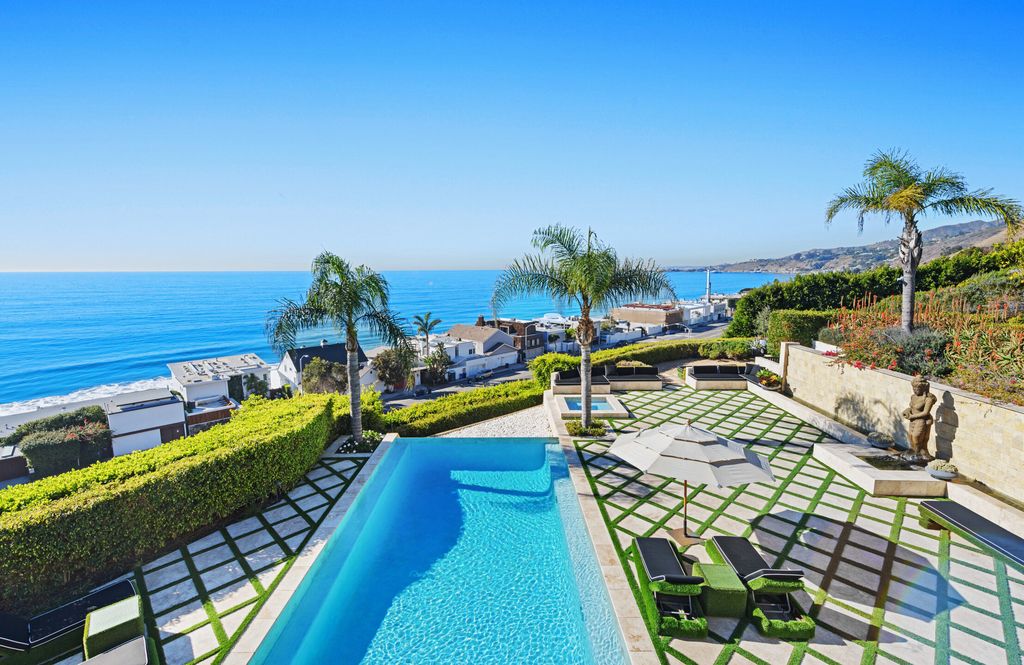 The Malibu Mansion is a private knoll top estate with exquisite finishes, superb quality, expansive views and lavish amenities now available for sale. This home located at 3905 Carbon Canyon Rd, Malibu, California; offering 6 bedrooms and 9 bathrooms with over 11,600 square feet of living spaces.
