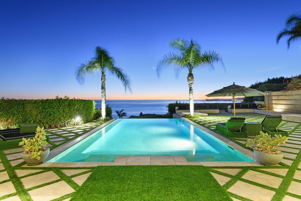 The Malibu Mansion is a private knoll top estate with exquisite finishes, superb quality, expansive views and lavish amenities now available for sale. This home located at 3905 Carbon Canyon Rd, Malibu, California; offering 6 bedrooms and 9 bathrooms with over 11,600 square feet of living spaces.