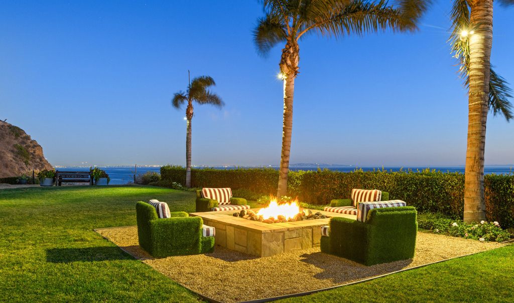 The Malibu Mansion is a private knoll top estate with exquisite finishes, superb quality, expansive views and lavish amenities now available for sale. This home located at 3905 Carbon Canyon Rd, Malibu, California; offering 6 bedrooms and 9 bathrooms with over 11,600 square feet of living spaces.