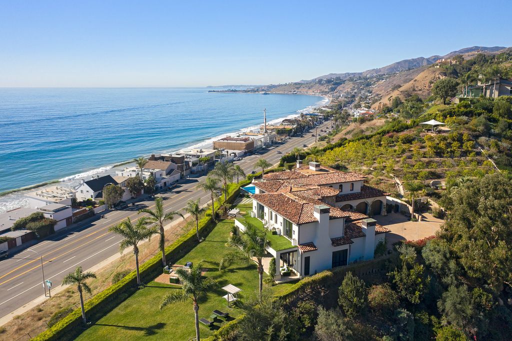 The Malibu Mansion is a private knoll top estate with exquisite finishes, superb quality, expansive views and lavish amenities now available for sale. This home located at 3905 Carbon Canyon Rd, Malibu, California; offering 6 bedrooms and 9 bathrooms with over 11,600 square feet of living spaces.