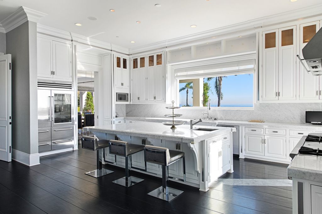 The Malibu Mansion is a private knoll top estate with exquisite finishes, superb quality, expansive views and lavish amenities now available for sale. This home located at 3905 Carbon Canyon Rd, Malibu, California; offering 6 bedrooms and 9 bathrooms with over 11,600 square feet of living spaces.