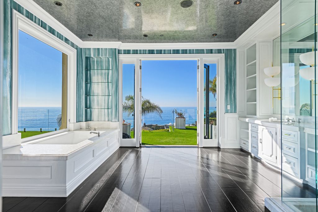 The Malibu Mansion is a private knoll top estate with exquisite finishes, superb quality, expansive views and lavish amenities now available for sale. This home located at 3905 Carbon Canyon Rd, Malibu, California; offering 6 bedrooms and 9 bathrooms with over 11,600 square feet of living spaces.
