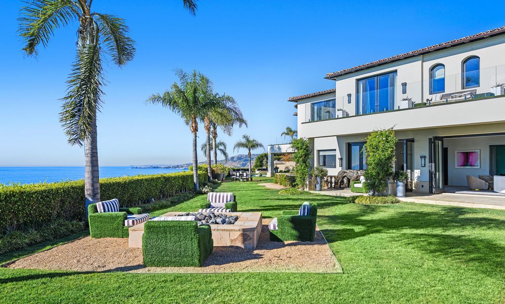 The Malibu Mansion is a private knoll top estate with exquisite finishes, superb quality, expansive views and lavish amenities now available for sale. This home located at 3905 Carbon Canyon Rd, Malibu, California; offering 6 bedrooms and 9 bathrooms with over 11,600 square feet of living spaces.