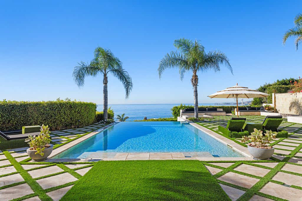 The Malibu Mansion is a private knoll top estate with exquisite finishes, superb quality, expansive views and lavish amenities now available for sale. This home located at 3905 Carbon Canyon Rd, Malibu, California; offering 6 bedrooms and 9 bathrooms with over 11,600 square feet of living spaces.