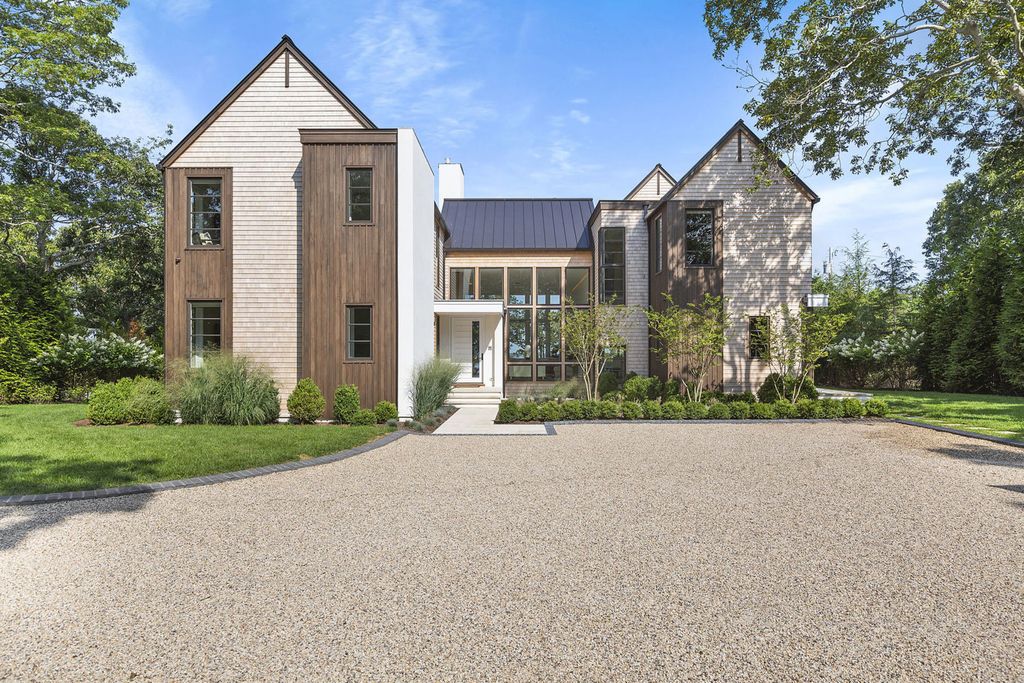 The Sag Harbor Home is a newly constructed and designed waterfront masterpiece designed by renowned architect Peter Cook now available for sale. This home located at 110 Hillside Dr E, Sag Harbor, New York; offering 8 bedrooms and 11 bathrooms with over 6,700 square feet of living spaces.