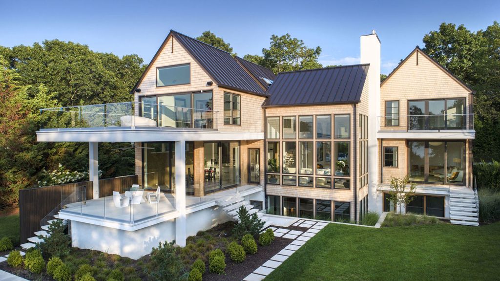 The Sag Harbor Home is a newly constructed and designed waterfront masterpiece designed by renowned architect Peter Cook now available for sale. This home located at 110 Hillside Dr E, Sag Harbor, New York; offering 8 bedrooms and 11 bathrooms with over 6,700 square feet of living spaces.